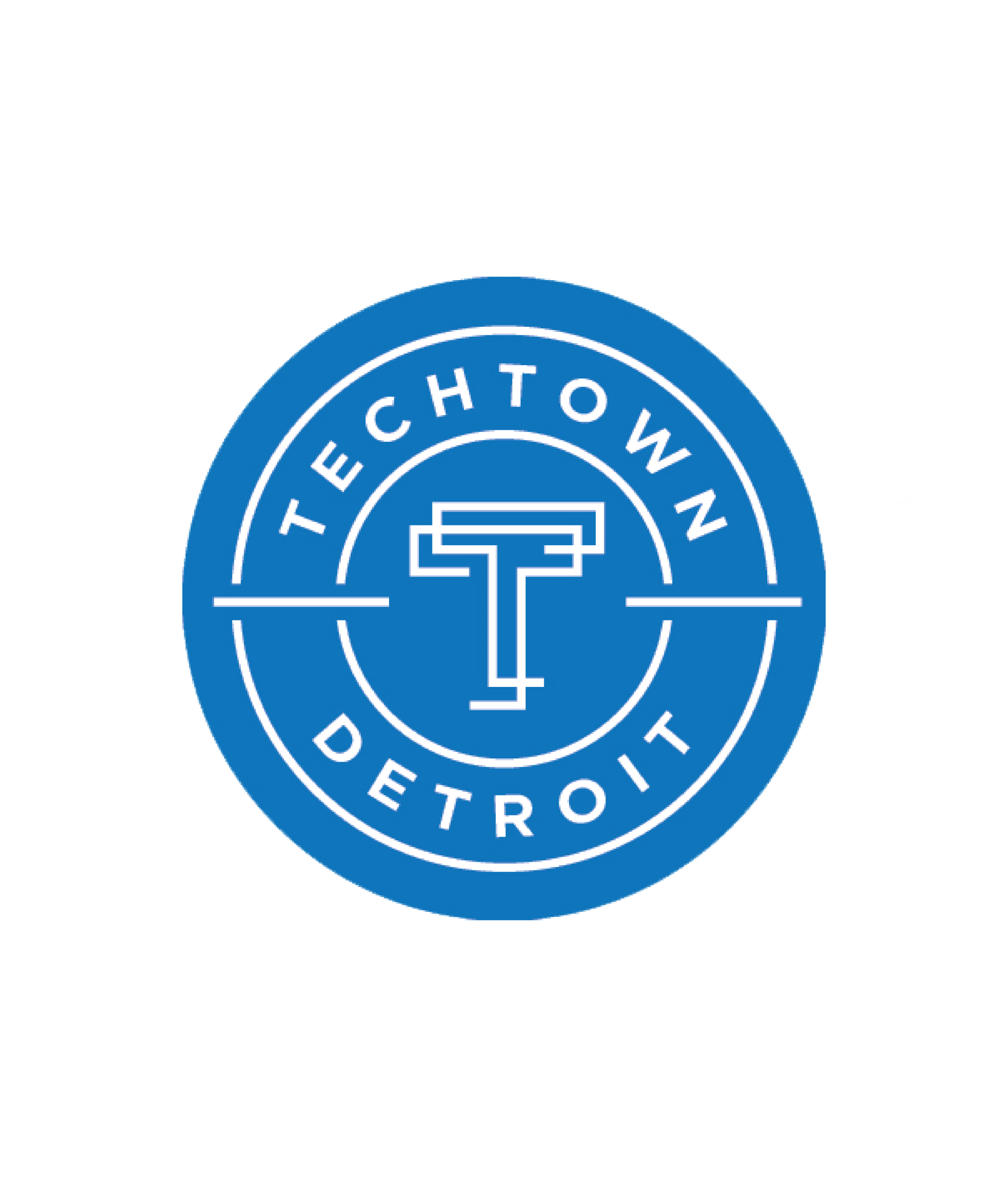 Logo circulaire bleu avec un T stylisé au centre, entouré des mots TechTown Detroit en texte blanc sur fond bleu.