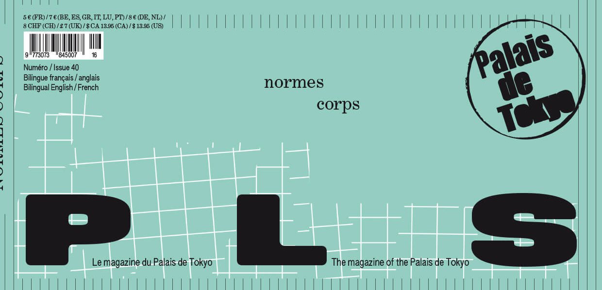 A person wearing a beige medical compression garment with a hand brace rests on a bed, colorful cords are in the background, and a tube of cream is visible.