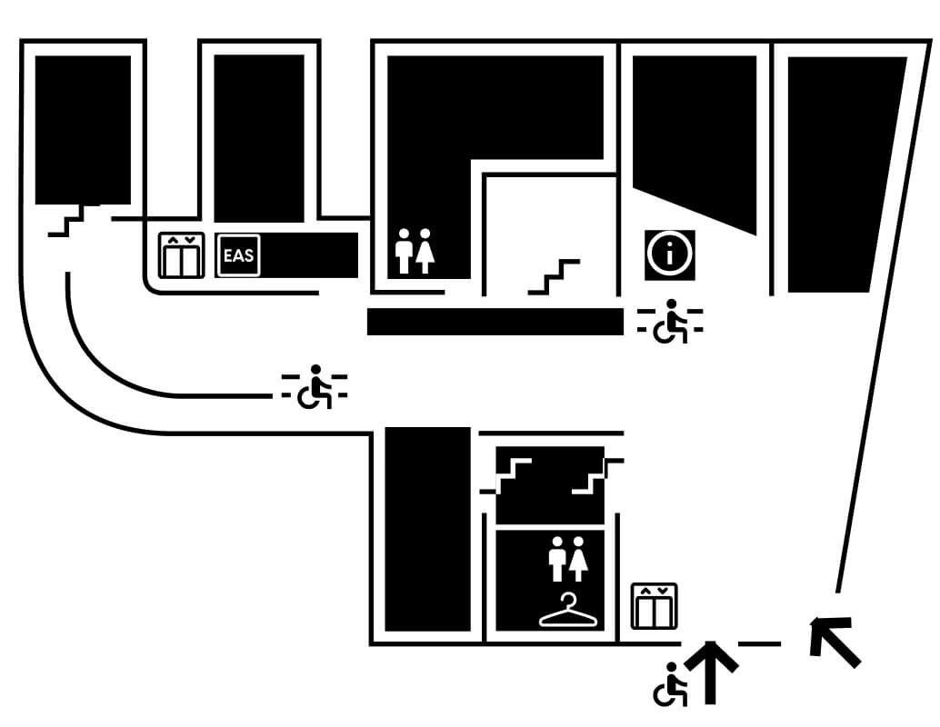 Plan d'étage en noir et blanc montrant les chemins accessibles vers les toilettes, les ascenseurs, le bureau d'information, la boutique de souvenirs et les escaliers, marqués de symboles de fauteuils roulants et de flèches directionnelles.